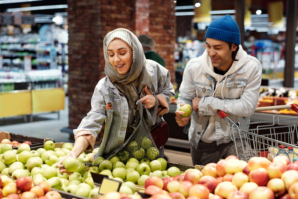 Couple Buying Apples