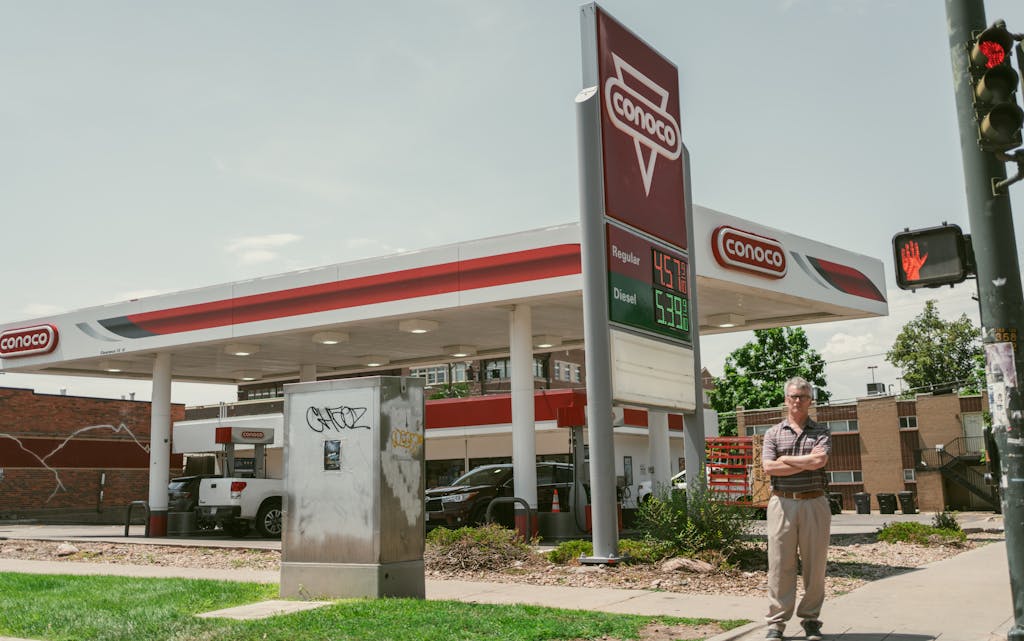 Man in front of a Gas Station